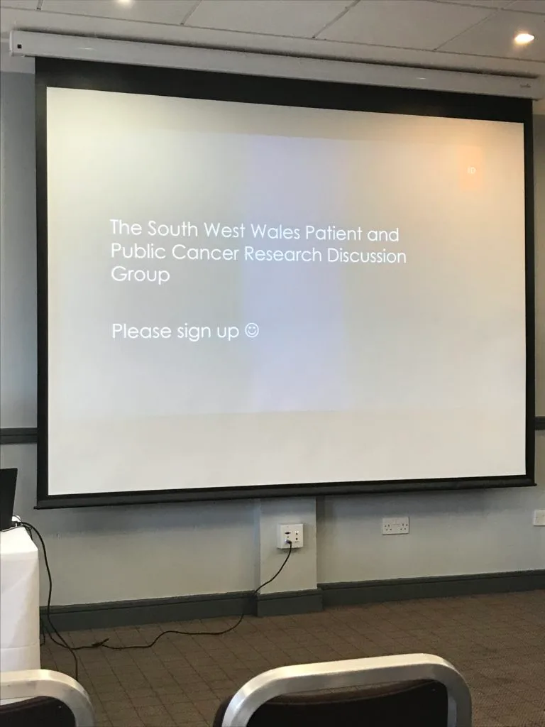 A conference slide inviting the audience to sign up to the South West Wales Patient and Public Cancer Research Discussion Group.