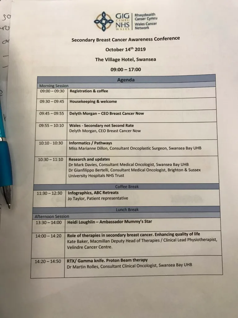The printed programme for the Secondary Breast Cancer Awareness Conference at The Village Hotel, Swansea, 14 October 2019.