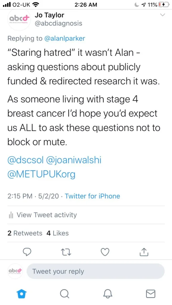 Jo Taylor replying that it was not staring hatred, it was asking questions about publicly funded and redirected research, and that as someone living with stage 4 breast cancer she would hope to be expected to ask these questions rather than be blocked or muted.