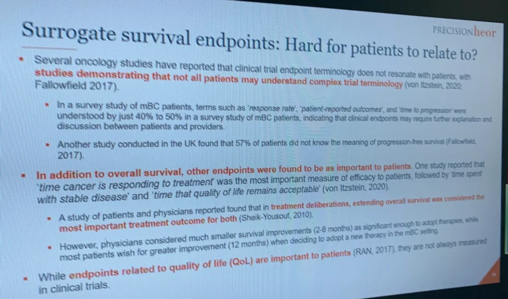 A roundtable slide asking whether surrogate survival endpoints are hard for patients to relate to, citing studies showing that clinical trial endpoint terminology does not resonate with patients.