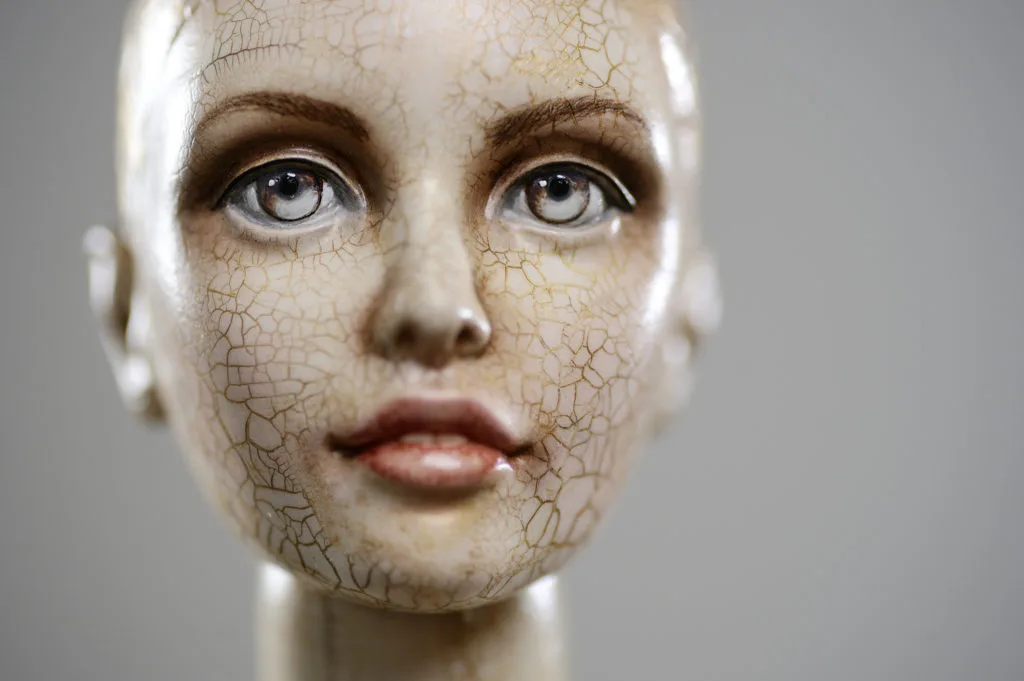 <p>Porcelain paper mache clay statuette girl pretty woman young girl smile blonde beauty handmade checkers handcrafted toy craft vintage decor doll gift texture skin defects concept</p>