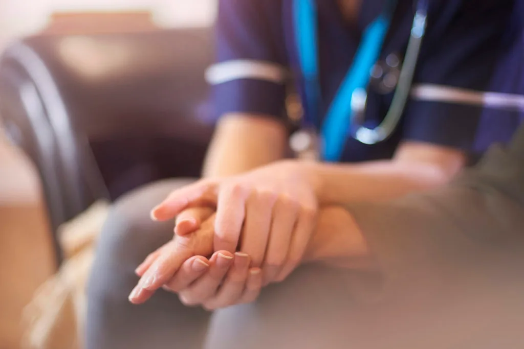 Nurse comforting patient - Paliative Care