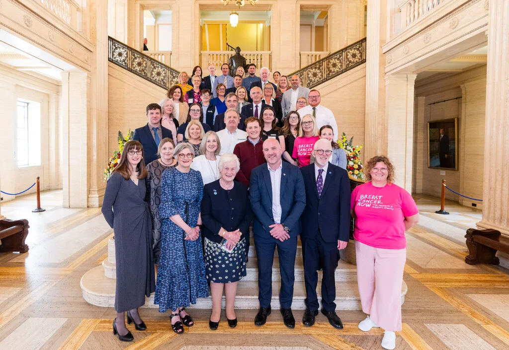 The Northern Ireland Cancer Charities Coalition gathered on the staircase at Parliament Buildings, Stormont.