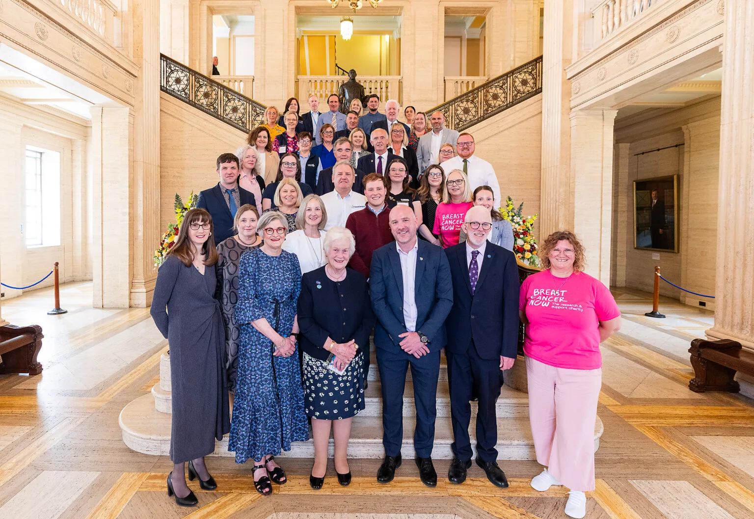 The Northern Ireland Cancer Charities Coalition gathered on the staircase at Parliament Buildings, Stormont.